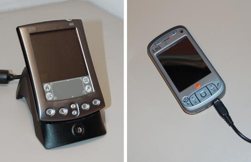 Palm PDA in a Cradle and HTC smartphone with a charger's cable